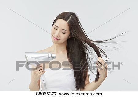 Stock Photo - Young Japanese model with beautiful hair. Fotosearch