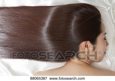 Stock Photo - Young Japanese model with beautiful hair. Fotosearch
