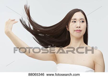Stock Photograph - Young Japanese model with beautiful hair. Fotosearch