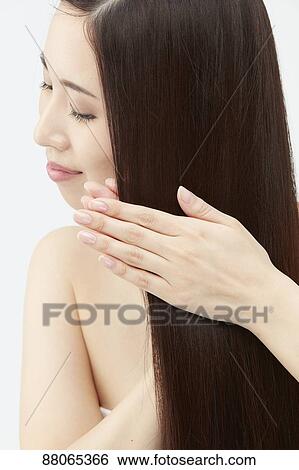 Young Japanese model with beautiful hair View Large Photo Image Stock Photograph - Young Japanese model with beautiful hair. Fotosearch