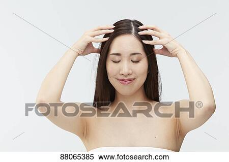 Stock Photography - Young Japanese model with beautiful hair. Fotosearch