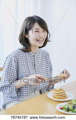 Young Japanese woman eating pancakes View Large Photo Image Stock Photo - Young Japanese woman eating pancakes. Fotosearch