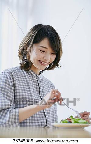 Young Japanese woman eating salad View Large Photo Image Stock Photography - Young Japanese woman eating salad. Fotosearch