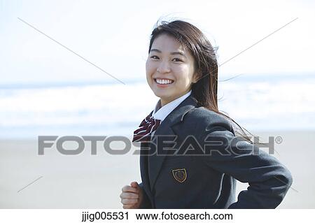 Young Japanese woman in a high school uniform running by the sea, Chiba, Japan View Large Photo Image Stock Image - Young Japanese woman in a high school uniform running by the sea, Chiba, Japan. Fotosearch