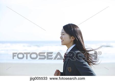Young Japanese woman in a high school uniform running by the sea, Chiba, Japan View Large Photo Image Stock Image - Young Japanese woman in a high school uniform running by the sea, Chiba, Japan. Fotosearch