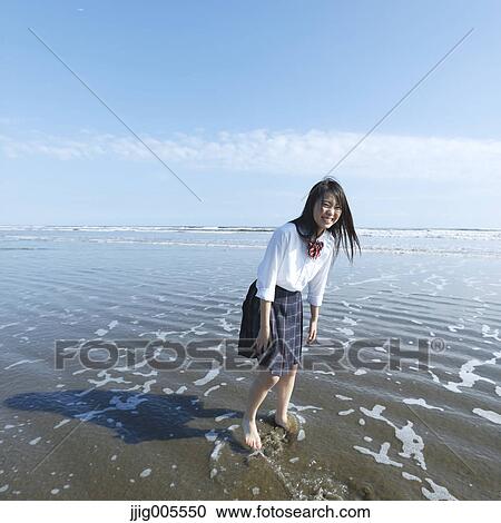 Young Japanese woman in a high school uniform running by the sea, Chiba, Japan View Large Photo Image Stock Image - Young Japanese woman in a high school uniform running by the sea, Chiba, Japan. Fotosearch
