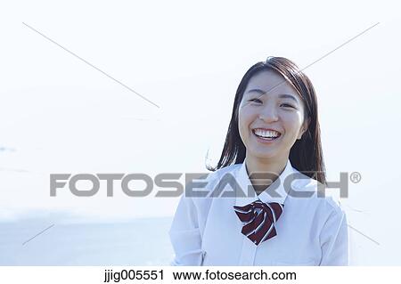 Young Japanese woman in a high school uniform by the sea, Chiba, Japan View Large Photo Image Stock Image - Young Japanese woman in a high school uniform by the sea, Chiba, Japan. Fotosearch