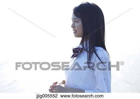 Young Japanese woman in a high school uniform by the sea, Chiba, Japan View Large Photo Image Stock Image - Young Japanese woman in a high school uniform by the sea, Chiba, Japan. Fotosearch