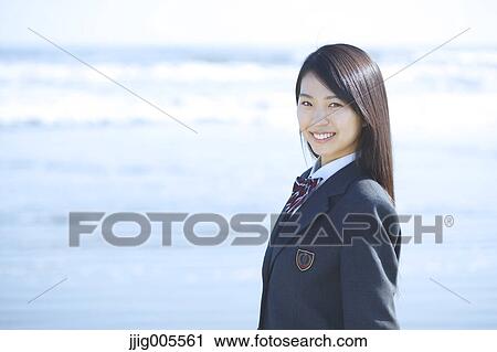 Young Japanese woman in a high school uniform by the sea, Chiba, Japan View Large Photo Image Stock Image - Young Japanese woman in a high school uniform by the sea, Chiba, Japan. Fotosearch