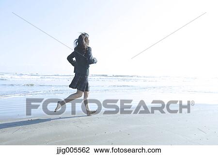 Young Japanese woman in a high school uniform running by the sea, Chiba, Japan View Large Photo Image Stock Image - Young Japanese woman in a high school uniform running by the sea, Chiba, Japan. Fotosearch