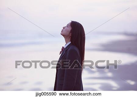 Young Japanese woman in a high school uniform by the sea, Chiba, Japan View Large Photo Image Stock Image - Young Japanese woman in a high school uniform by the sea, Chiba, Japan. Fotosearch