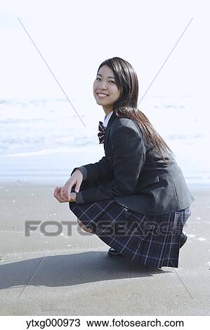 Young Japanese woman in a high school uniform by the sea, Chiba, Japan View Large Photo Image Stock Image - Young Japanese woman in a high school uniform by the sea, Chiba, Japan. Fotosearch