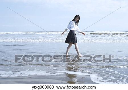 Young Japanese woman in a high school uniform by the sea, Chiba, Japan View Large Photo Image Stock Image - Young Japanese woman in a high school uniform by the sea, Chiba, Japan. Fotosearch