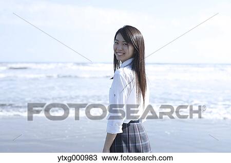 Young Japanese woman in a high school uniform by the sea, Chiba, Japan View Large Photo Image Stock Image - Young Japanese woman in a high school uniform by the sea, Chiba, Japan. Fotosearch
