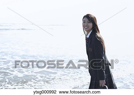 Young Japanese woman in a high school uniform by the sea, Chiba, Japan View Large Photo Image Stock Image - Young Japanese woman in a high school uniform by the sea, Chiba, Japan. Fotosearch