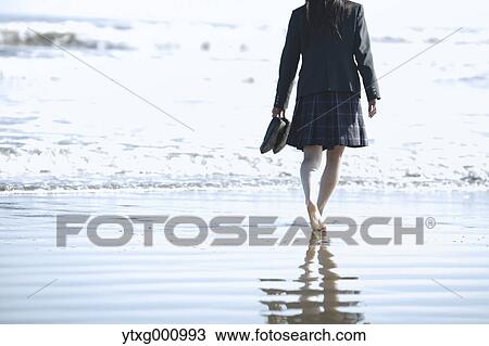 Young Japanese woman in a high school uniform by the sea, Chiba, Japan View Large Photo Image Stock Image - Young Japanese woman in a high school uniform by the sea, Chiba, Japan. Fotosearch