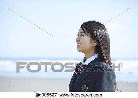 Young Japanese woman in a high school uniform by the sea, Chiba, Japan View Large Photo Image Stock Photo - Young Japanese woman in a high school uniform by the sea, Chiba, Japan. Fotosearch