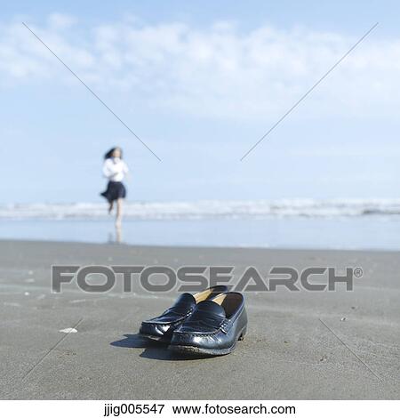 Young Japanese woman in a high school uniform running by the sea, Chiba, Japan View Large Photo Image Stock Photo - Young Japanese woman in a high school uniform running by the sea, Chiba, Japan. Fotosearch