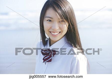 Young Japanese woman in a high school uniform by the sea, Chiba, Japan View Large Photo Image Stock Photo - Young Japanese woman in a high school uniform by the sea, Chiba, Japan. Fotosearch