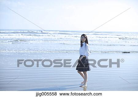 Young Japanese woman in a high school uniform by the sea, Chiba, Japan View Large Photo Image Stock Photo - Young Japanese woman in a high school uniform by the sea, Chiba, Japan. Fotosearch