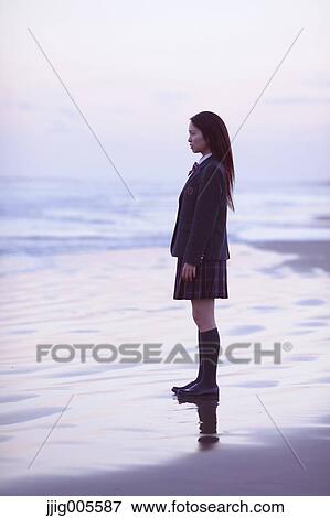 Young Japanese woman in a high school uniform by the sea, Chiba, Japan View Large Photo Image Stock Photo - Young Japanese woman in a high school uniform by the sea, Chiba, Japan. Fotosearch