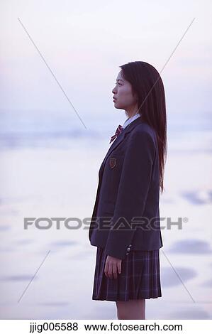 Young Japanese woman in a high school uniform by the sea, Chiba, Japan View Large Photo Image Stock Photo - Young Japanese woman in a high school uniform by the sea, Chiba, Japan. Fotosearch