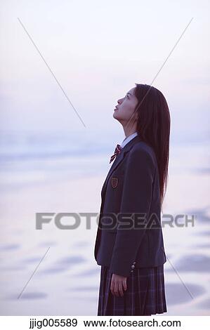 Young Japanese woman in a high school uniform by the sea, Chiba, Japan View Large Photo Image Stock Photo - Young Japanese woman in a high school uniform by the sea, Chiba, Japan. Fotosearch