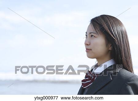 Young Japanese woman in a high school uniform by the sea, Chiba, Japan View Large Photo Image Stock Photo - Young Japanese woman in a high school uniform by the sea, Chiba, Japan. Fotosearch