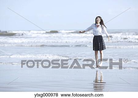 Young Japanese woman in a high school uniform by the sea, Chiba, Japan View Large Photo Image Stock Photo - Young Japanese woman in a high school uniform by the sea, Chiba, Japan. Fotosearch