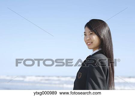 Young Japanese woman in a high school uniform by the sea, Chiba, Japan View Large Photo Image Stock Photo - Young Japanese woman in a high school uniform by the sea, Chiba, Japan. Fotosearch