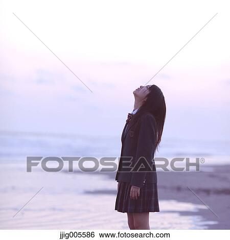 Young Japanese woman in a high school uniform by the sea, Chiba, Japan View Large Photo Image Stock Photograph - Young Japanese woman in a high school uniform by the sea, Chiba, Japan. Fotosearch