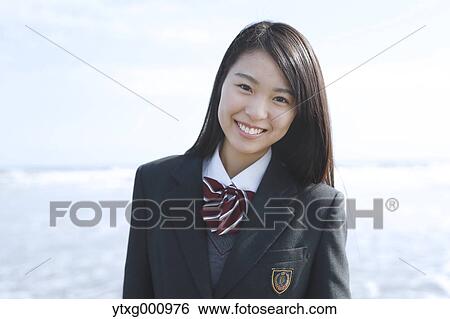 Young Japanese woman in a high school uniform by the sea, Chiba, Japan View Large Photo Image Stock Photograph - Young Japanese woman in a high school uniform by the sea, Chiba, Japan. Fotosearch