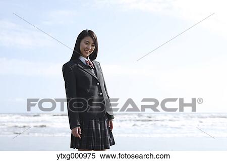 Young Japanese woman in a high school uniform by the sea, Chiba, Japan View Large Photo Image Stock Photography - Young Japanese woman in a high school uniform by the sea, Chiba, Japan. Fotosearch