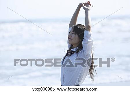 Young Japanese woman in a high school uniform by the sea, Chiba, Japan View Large Photo Image Stock Photography - Young Japanese woman in a high school uniform by the sea, Chiba, Japan. Fotosearch