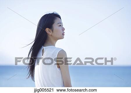 Young Japanese woman in a white dress by the sea, Chiba, Japan View Large Photo Image Stock Image - Young Japanese woman in a white dress by the sea, Chiba, Japan. Fotosearch