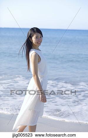 Young Japanese woman in a white dress by the sea, Chiba, Japan View Large Photo Image Stock Image - Young Japanese woman in a white dress by the sea, Chiba, Japan. Fotosearch