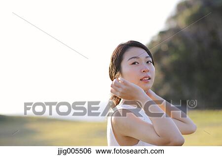 Young Japanese woman in a white dress at a cliff over the sea at sunrise, Chiba, Japan View Large Photo Image Stock Photograph - Young Japanese woman in a white dress at a cliff over the sea at sunrise, Chiba, Japan. Fotosearch