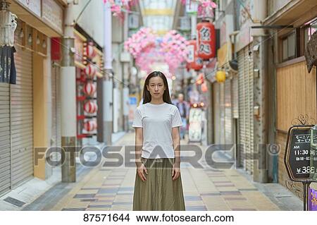 Picture - Young Japanese woman in Osaka. Fotosearch