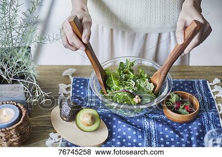 Young Japanese woman preparing salad View Large Photo Image Stock Photo - Young Japanese woman preparing salad. Fotosearch