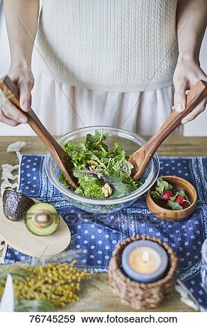Young Japanese woman preparing salad View Large Photo Image Stock Photo - Young Japanese woman preparing salad. Fotosearch