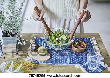Young Japanese woman preparing salad View Large Photo Image Stock Photography - Young Japanese woman preparing salad. Fotosearch