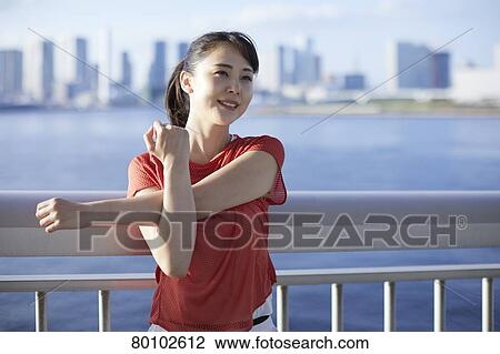 Young Japanese woman training downtown Tokyo View Large Photo Image Stock Image - Young Japanese woman training downtown Tokyo. Fotosearch