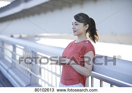 Young Japanese woman training downtown Tokyo View Large Photo Image Stock Image - Young Japanese woman training downtown Tokyo. Fotosearch