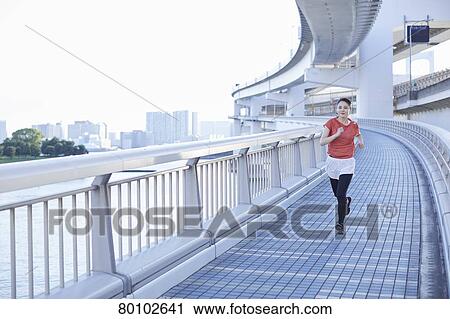 Young Japanese woman training downtown Tokyo View Large Photo Image Stock Image - Young Japanese woman training downtown Tokyo. Fotosearch