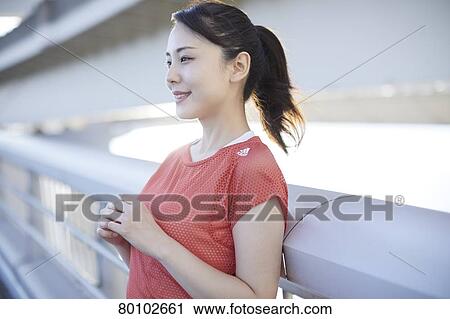 Young Japanese woman training downtown Tokyo View Large Photo Image Stock Image - Young Japanese woman training downtown Tokyo. Fotosearch