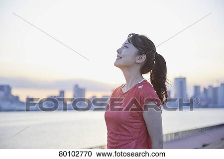 Young Japanese woman training downtown Tokyo View Large Photo Image Stock Image - Young Japanese woman training downtown Tokyo. Fotosearch