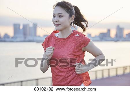 Young Japanese woman training downtown Tokyo View Large Photo Image Stock Image - Young Japanese woman training downtown Tokyo. Fotosearch
