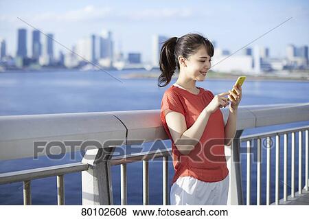 Young Japanese woman training downtown Tokyo View Large Photo Image Stock Photo - Young Japanese woman training downtown Tokyo. Fotosearch