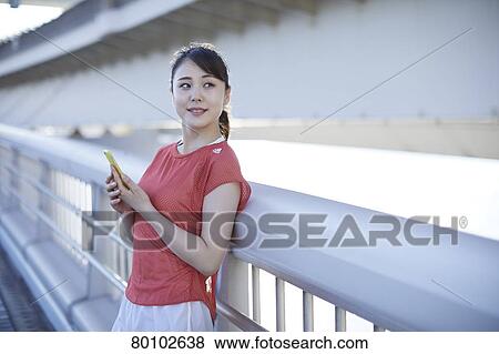Young Japanese woman training downtown Tokyo View Large Photo Image Stock Photo - Young Japanese woman training downtown Tokyo. Fotosearch
