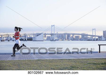 Young Japanese woman training downtown Tokyo View Large Photo Image Stock Photo - Young Japanese woman training downtown Tokyo. Fotosearch